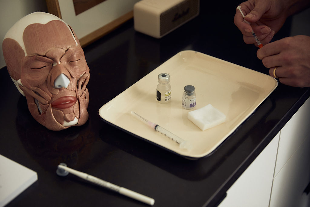 syringes and bottles of botox and fillers