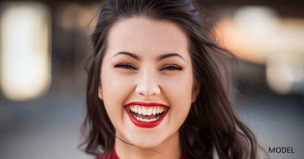 Woman in her 20s smiling for the camera